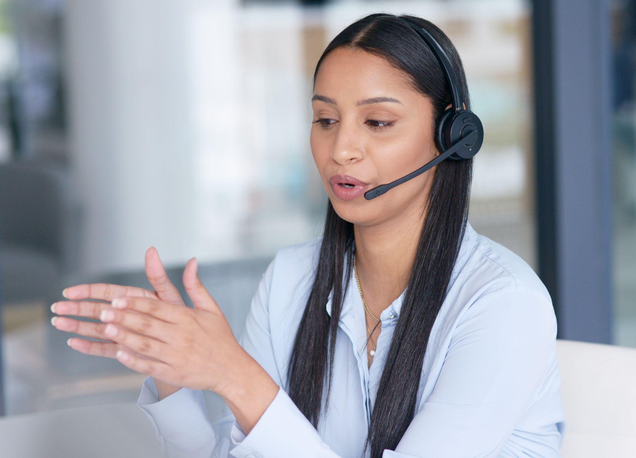 Young call center agent working in an office.